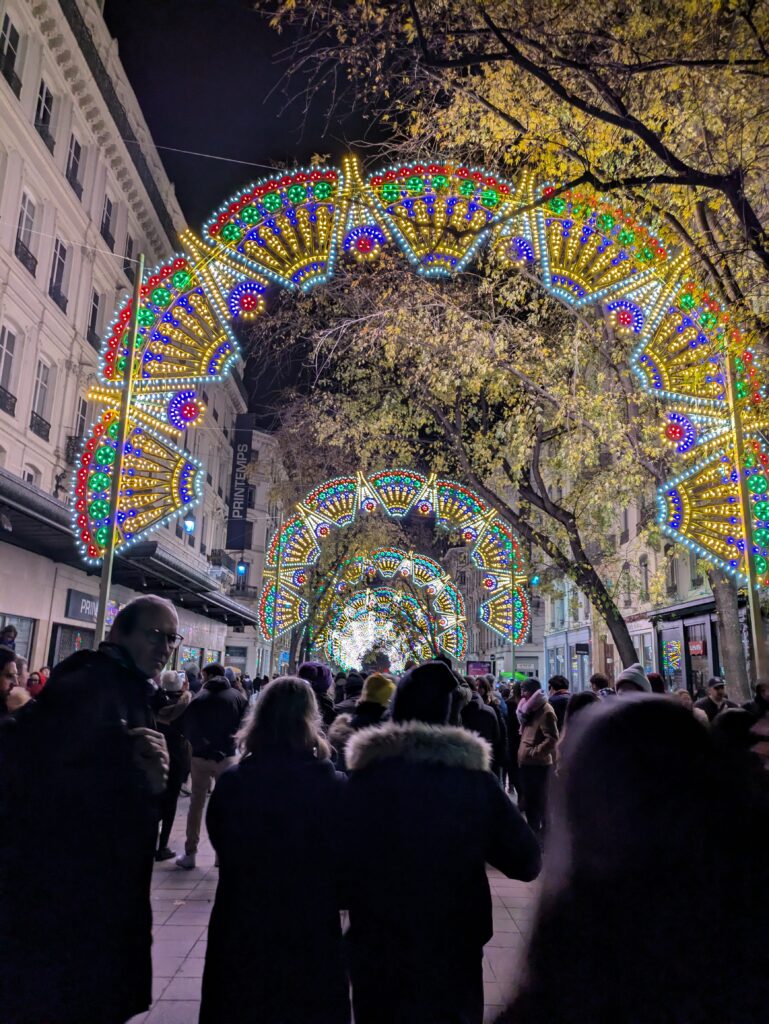 Downtown Lyon street decorated with colorful lights during the Festival of Lights